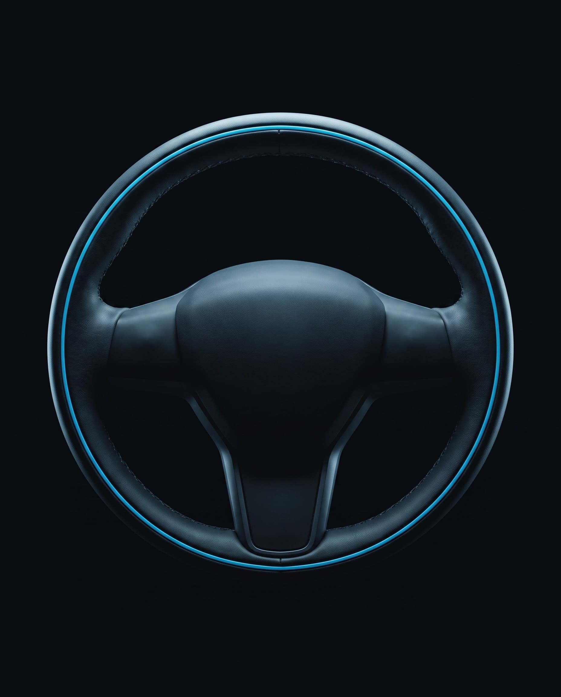 An unattended steering wheel, centered in darkness with a single cyan rim light